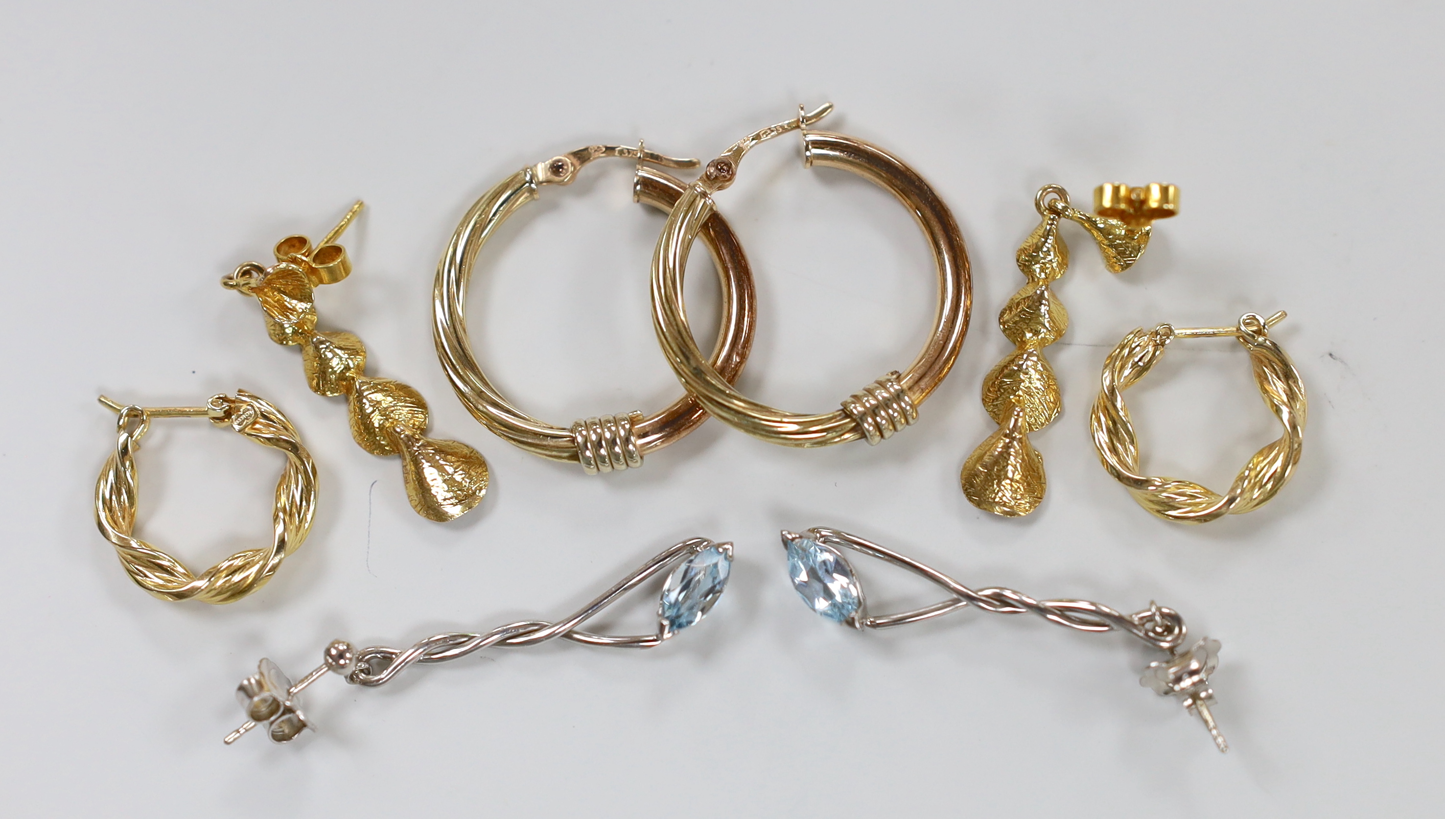 A pair of modern 9ct white gold and blue topaz? set drop earrings, 33mm and three assorted pairs of 9ct gold earrings, gross 10.6 grams.